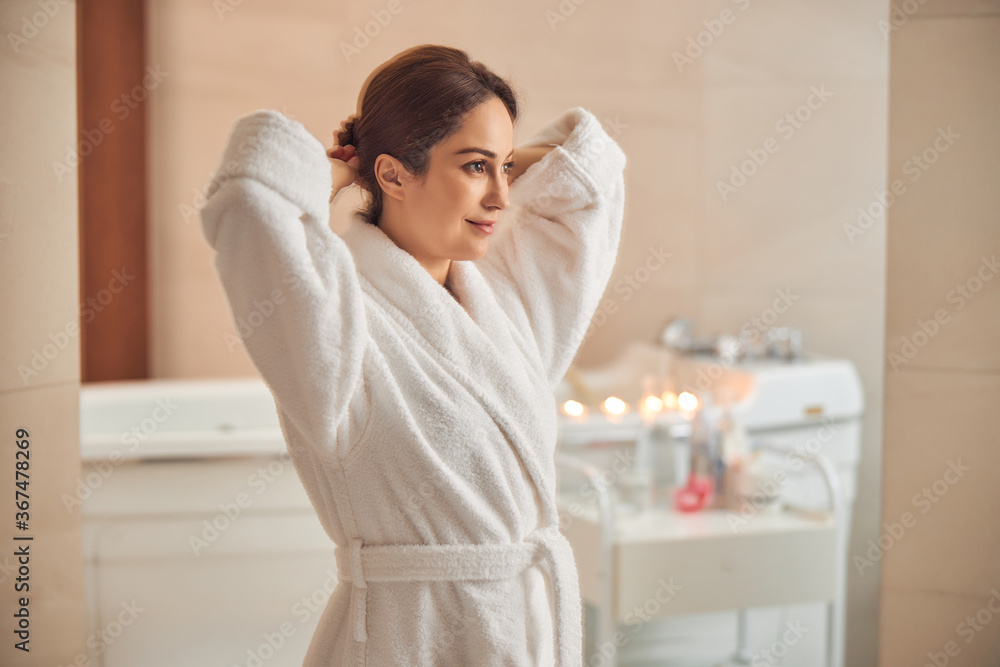 Young woman looking quiet and satisfied at wellness center Young woman looking quiet and satisfied at wellness center