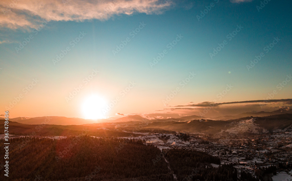 Obraz premium Carpathian mountains winter. Snow coniferous forest at sunset.