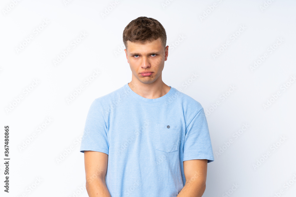 Young handsome man over isolated white background with sad and depressed expression Young handsome man over isolated white background with sad and depressed expression