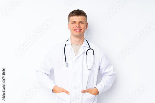 Young handsome man over isolated white background with doctor gown © luismolinero