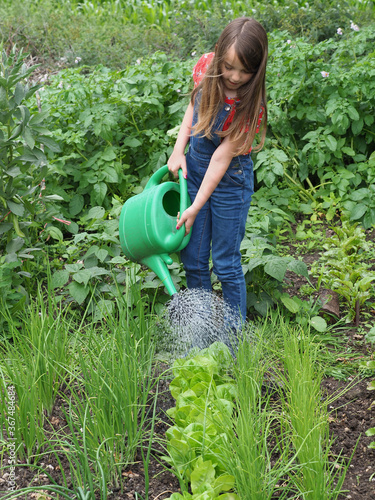 Obraz na plátne Young Girl In Vegetable Garden