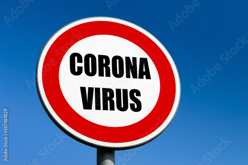 A red circle traffic sign demanding the corona virus SARS-CoV-2 and COIVID-19 disease to stop © mino21