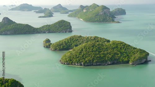 Bird eye panoramic aerial top view of Islands in ocean at Ang Thong National Marine Park near touristic Samui paradise tropical resort. Archipelago in the Gulf of Thailand. Idyllic natural background