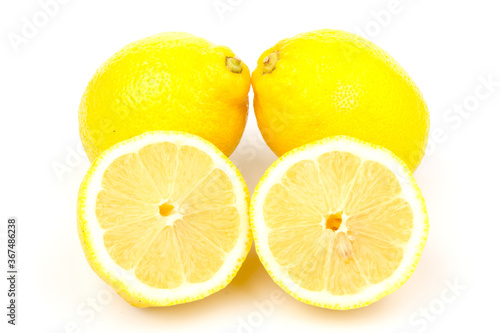 Group of lemons in close up, isolated on white background