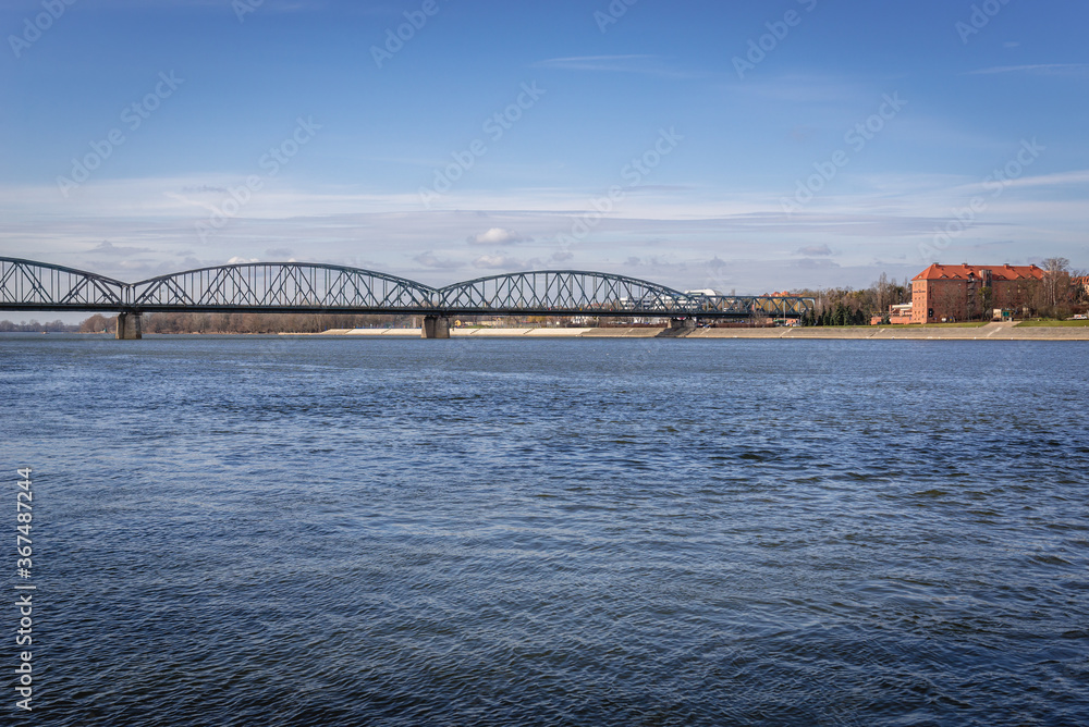 Fototapeta premium Jozef Pilsudski Bridge over River Vistula in Torun city, Poland