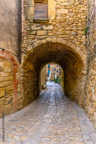 Narrow street in the old town of Peratallada  Catalonia  Spain 