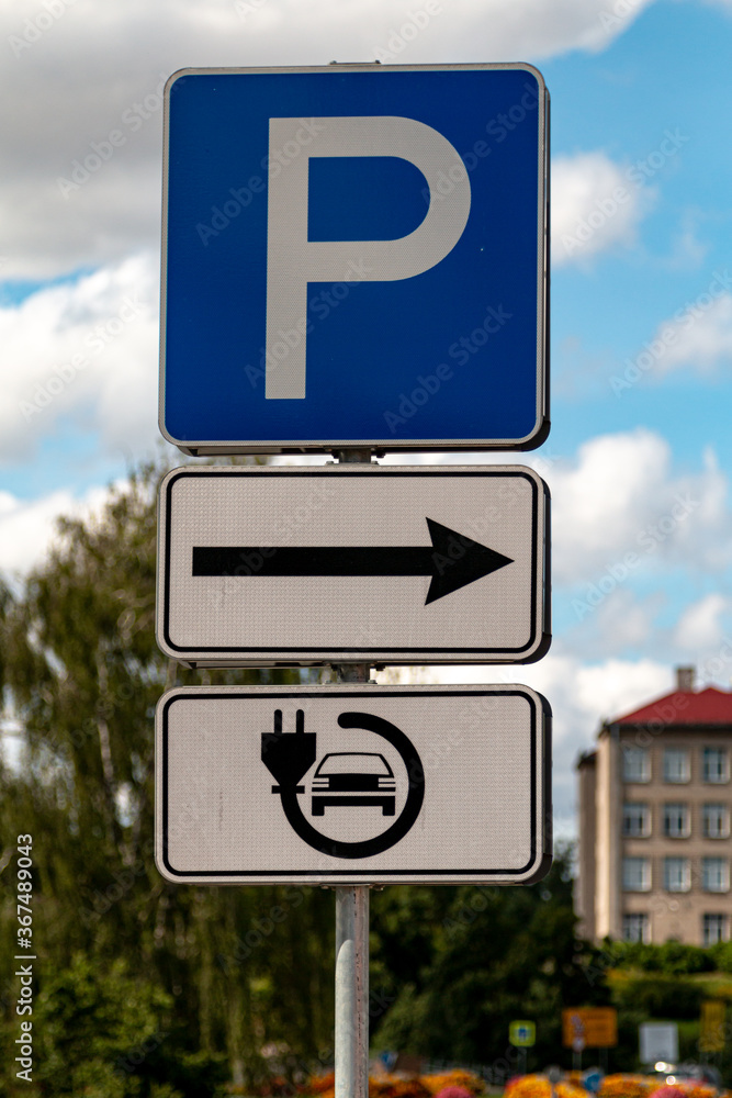 Electric vehicle charging station sign. Parking sign Electric vehicle charging station sign. Parking sign