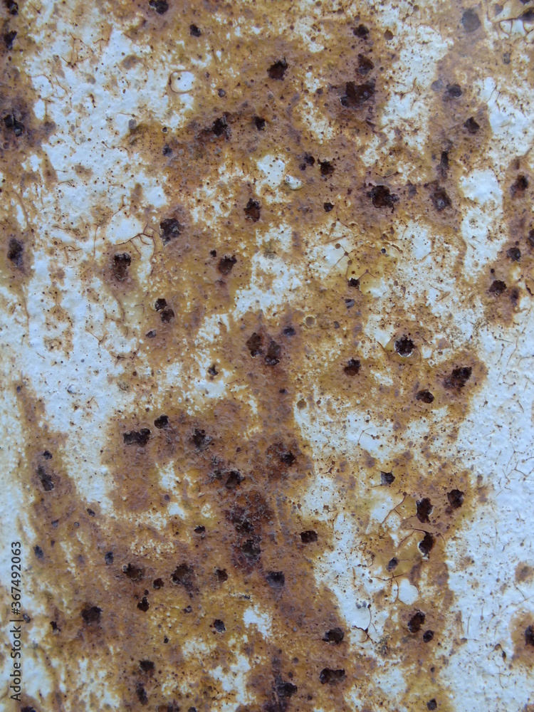 White metal surface with brown rust and corrosion White metal surface with brown rust and corrosion