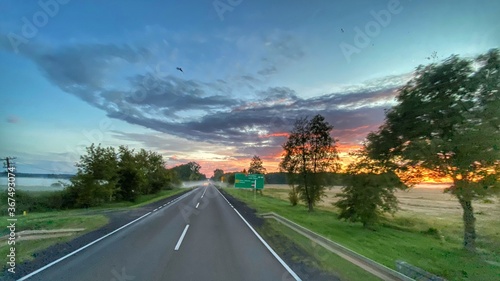 Road in Poland. Sunset. Goldenhour. Beautiful sky. 