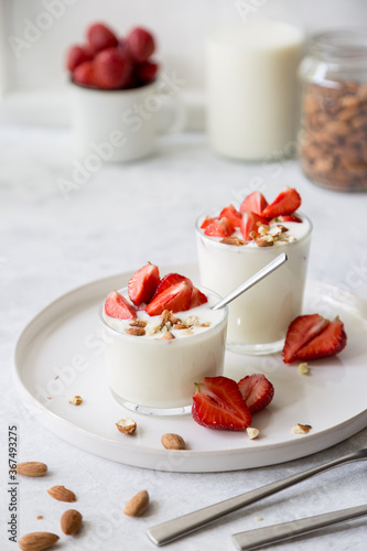 Natural strawberry yogurt with fresh berry and almond