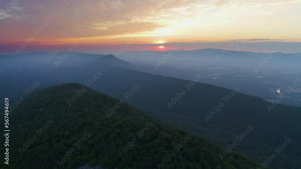 An aerial shot (dolly in) at sunrise above Catback Mountain and Duncan Knob in the Massanutten Range in George Washington National Forest in Page County, VA. An aerial shot (dolly in) at sunrise above Catback Mountain and Duncan Knob in the Massanutten Range in George Washington National Forest in Page County, VA.