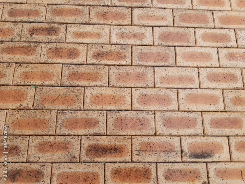 Fototapeta premium foot worn red brick texture