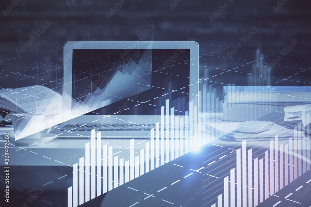 Stock market chart hologram drawn on personal computer background. Double exposure. Concept of investment. Stock market chart hologram drawn on personal computer background. Double exposure. Concept of investment.