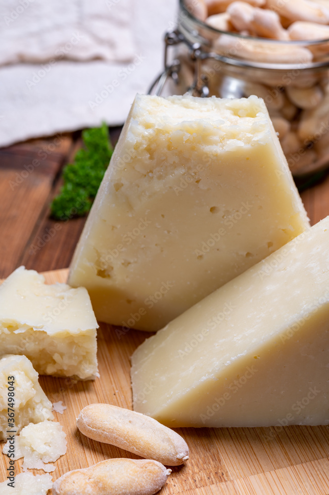 Pieces of matured pecorino romano italian cheese made from sheep milk in Lazio, Sardinia or Tuscany