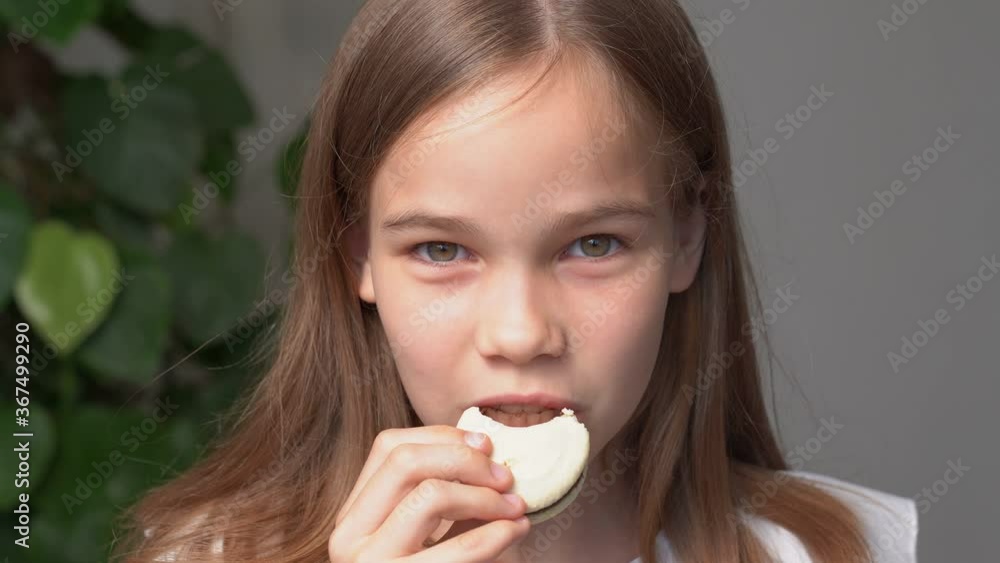 teen girl bites of macaron eating teen girl bites of macaron eating