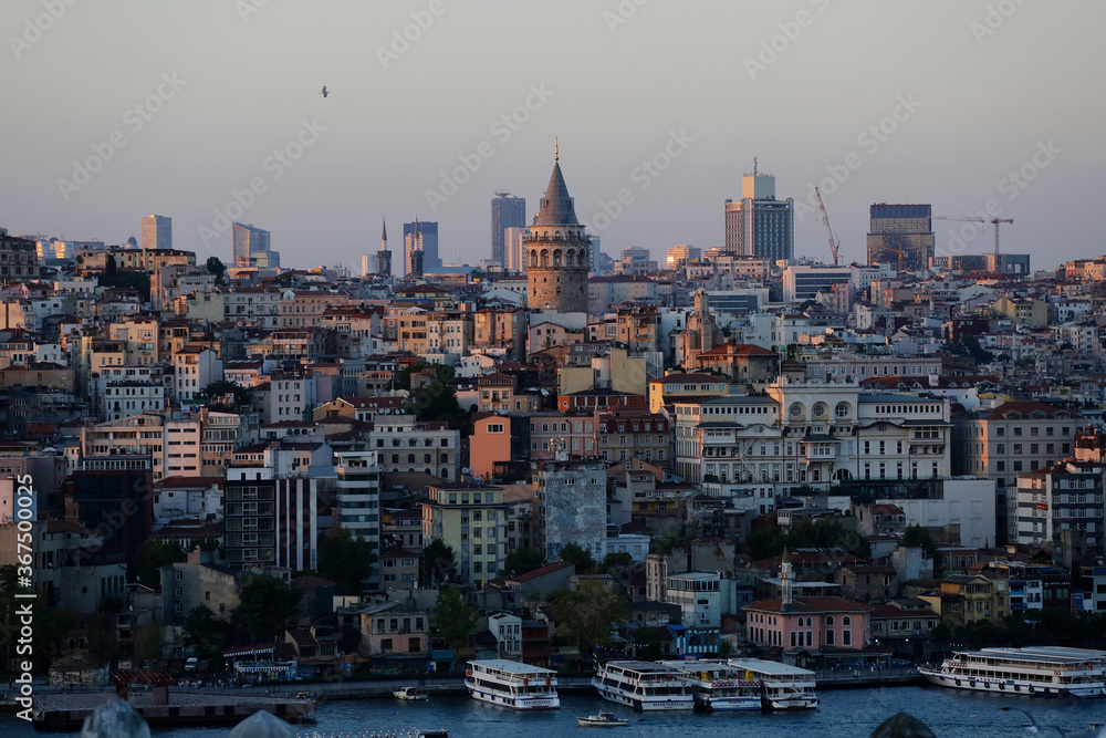 The iconic Galata Tower is seen in the center of the skyline of Istanbul, Turkey, in a picture taken from the Suleymaniye mosque during a summer afternoon.