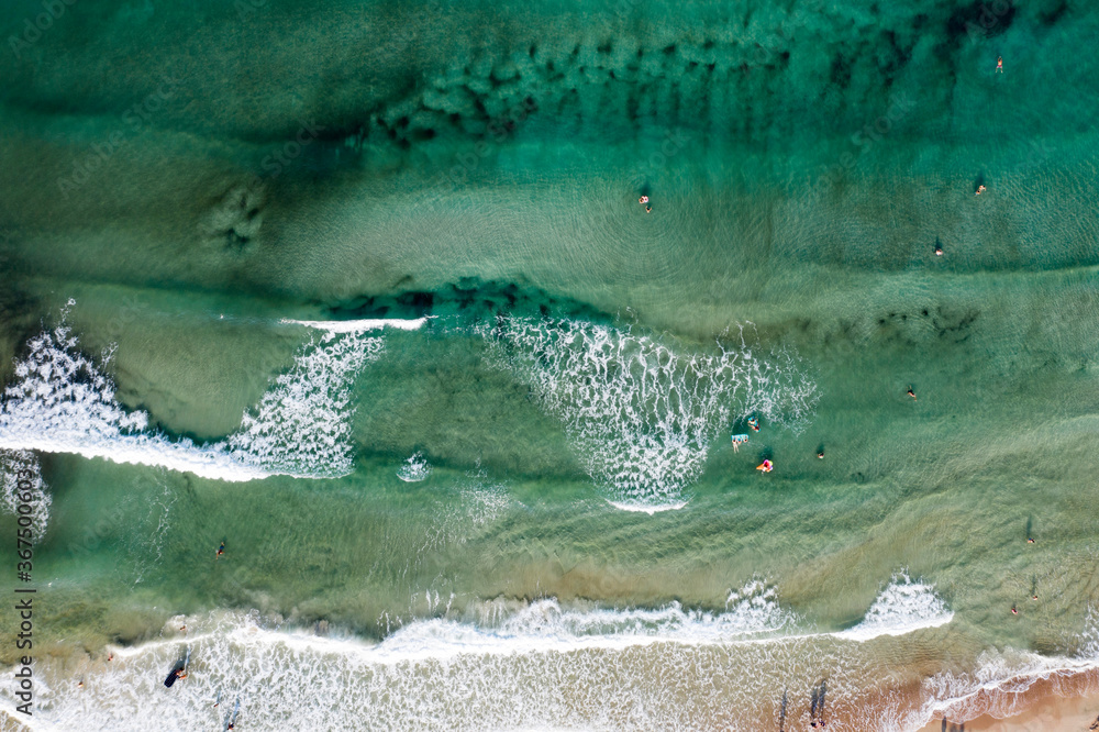 Fototapeta premium Thassos seaside beach with turquoise water and big waves aerial view.