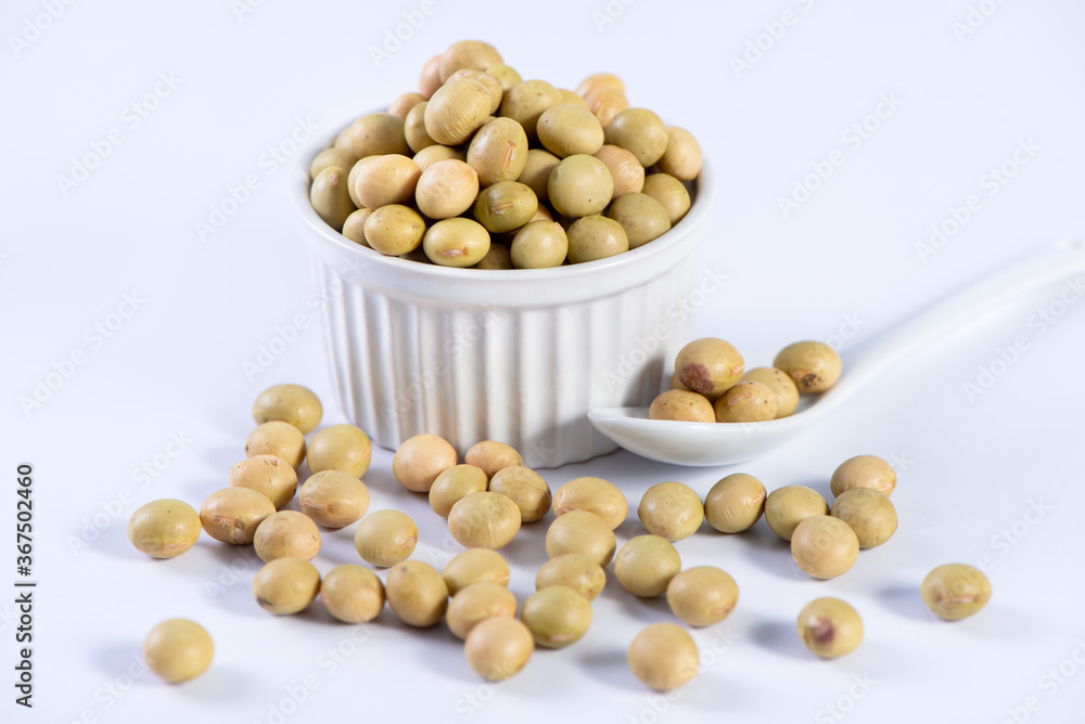 Yellow-green Taiwanese organic non-GMO soybeans, soy beans in a container isolated on white backgorund, close up, clipping path. Yellow-green Taiwanese organic non-GMO soybeans, soy beans in a container isolated on white backgorund, close up, clipping path.