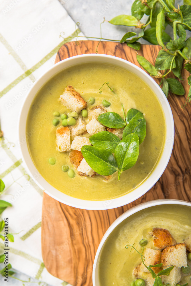 Plate of summer delicious pea soup with green peas. Top view Plate of summer delicious pea soup with green peas. Top view