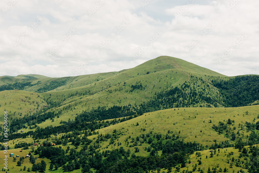 View of a beautiful mountain range in summer time View of a beautiful mountain range in summer time