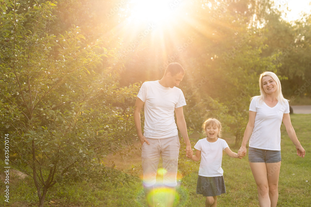 Fototapeta premium happy young family spending time outdoor on a summer day