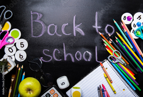 style school elements - book, pen, pencils,  apple on blackboard. Back to school design template.