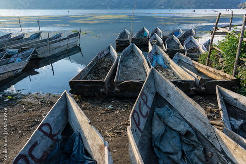 canoas varadas en el lago Atitlán, Santiago Atitlan, departamento de Sololá, Guatemala, Central America photo