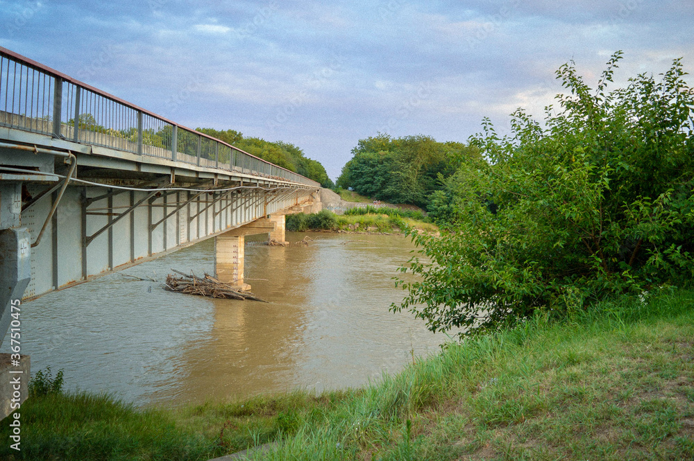 Bridge with concrete pillars across the river