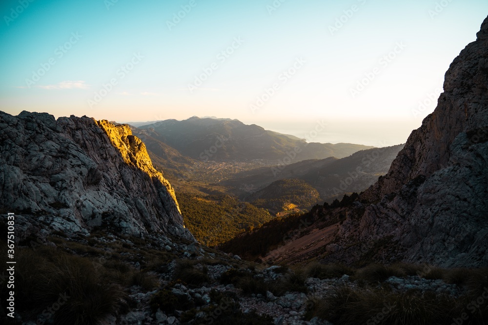 Horizontal photo of a view from a mountain of the Valley of Soller (Serra de Tramuntana, Mallorca, Spain) during golden hour