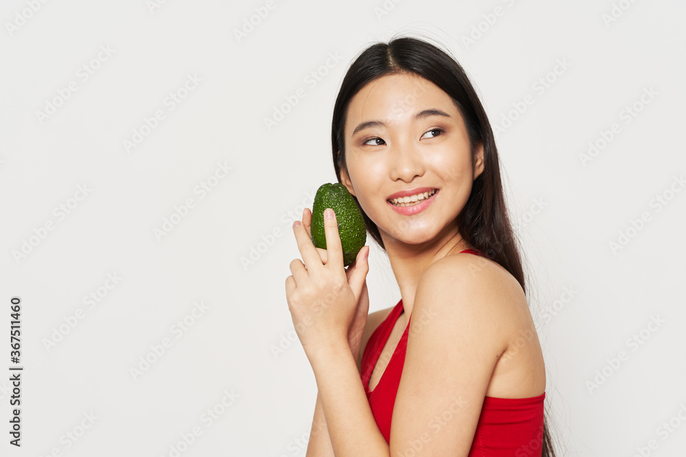 Woman with avocado on isolated background diet Woman with avocado on isolated background diet