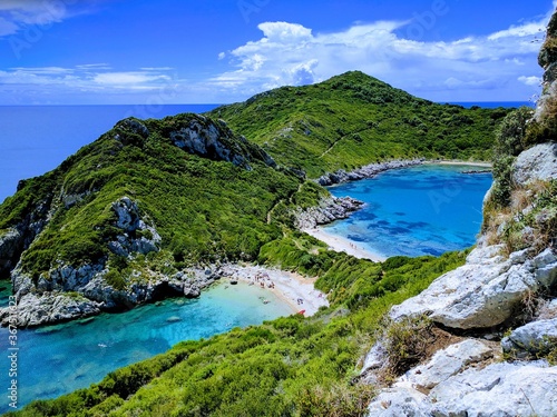 Afionas beach (Porto Timoni) as seen from a higher angle with crystal clear azure water and empty beaches in Corfu (Corfu, Greece, Europe)