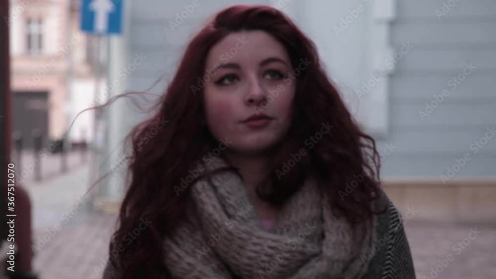 Woman Facing the Camera Walking in a coat in late autumn Woman Facing the Camera Walking in a coat in late autumn