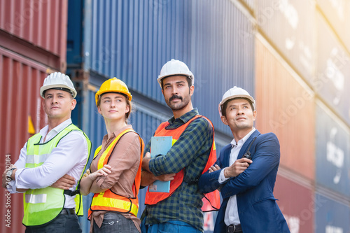 Industrial worker working at cargo freight logistic warehouse for import export, foreman team meeting and brainstorm , Import and export business.
