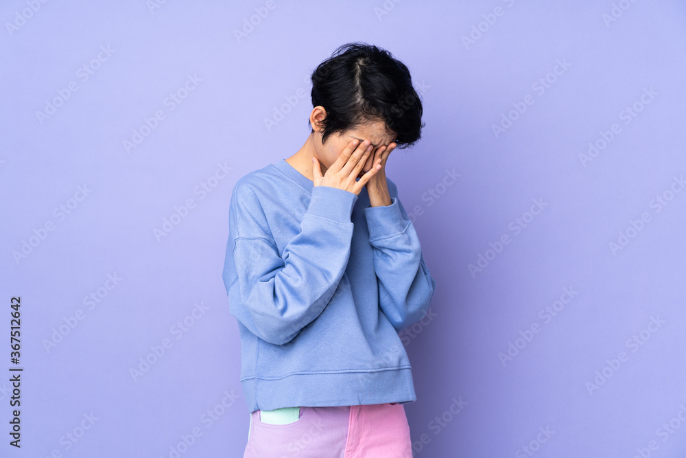 Young asian woman isolated on blue background
Young asian woman isolated on blue background