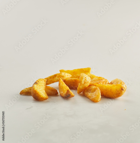 Potato wedges shot on white background
