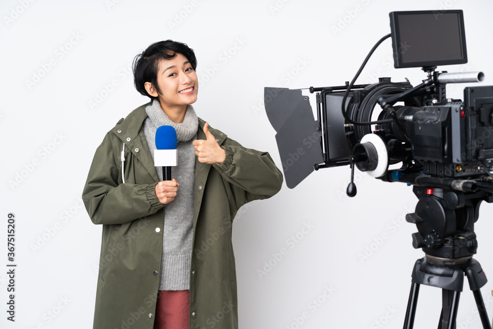 Reporter Vietnamese woman holding a microphone and reporting news giving a thumbs up gesture