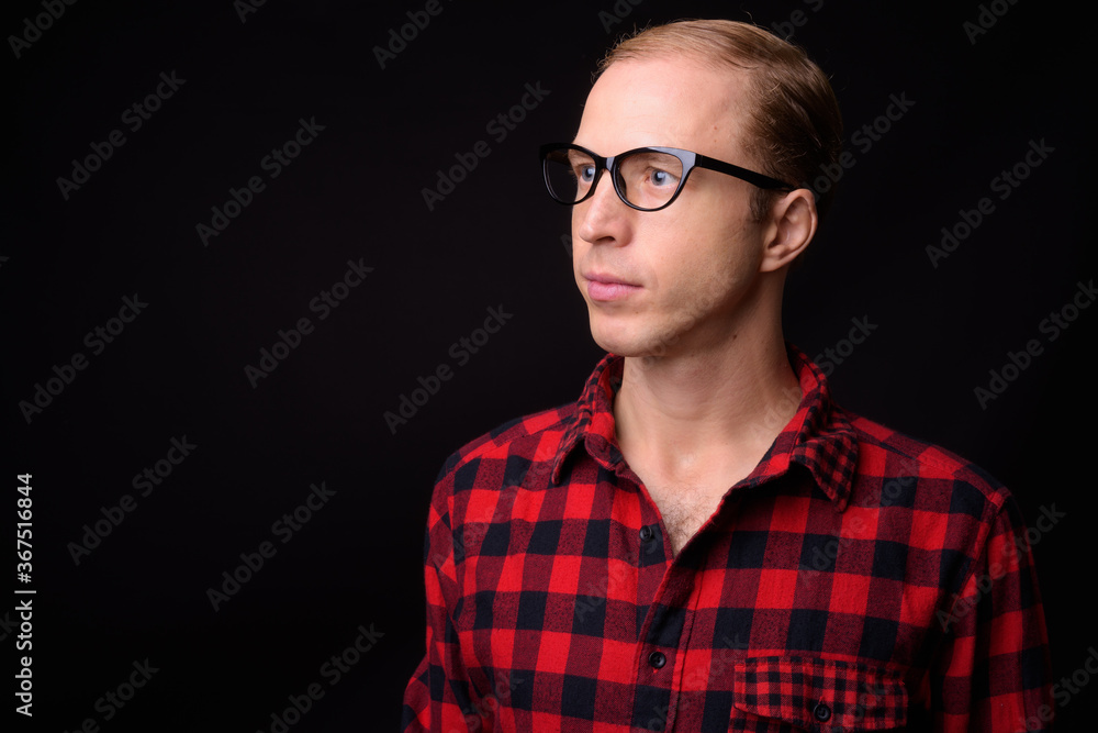 Man with blond hair against black background Man with blond hair against black background