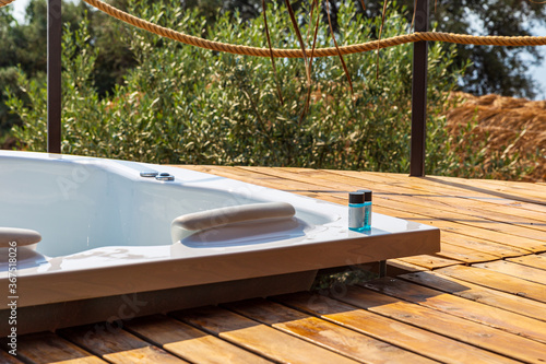 Hot tub in the room balcony with sea view. Luxury honeymoon romantic vacation place.