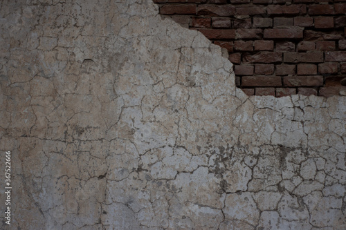 Old collapsed wall with plaster