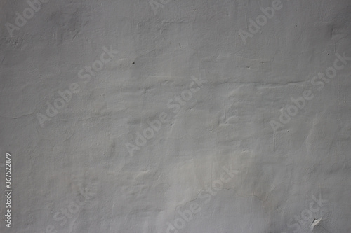 Old wall covered with white plaster