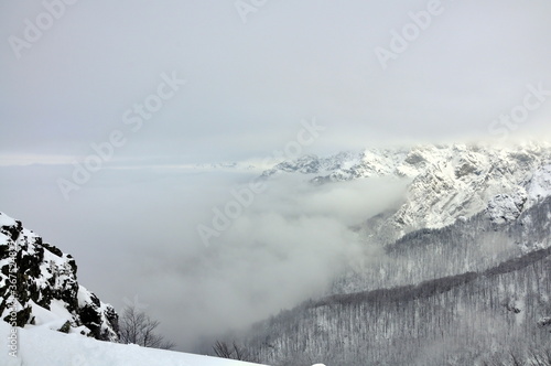 Rocks near Peak Botev, the highest peak of the Balkan Mountains and morning fog