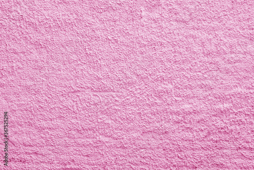 Abstract pink background. Rough irregularities in the plaster. Wall surface.