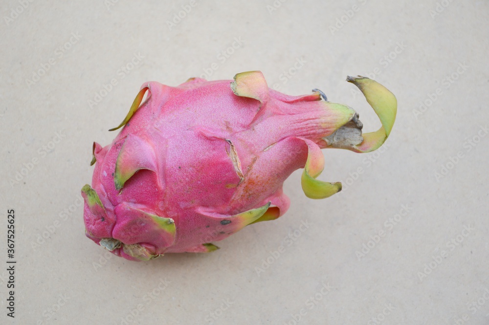 pink dragon fruit on wood plank pink dragon fruit on wood plank
