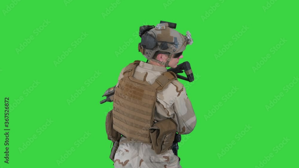 Fully Equipped Solder Holding Assault Rifle and Standing looking to the ...