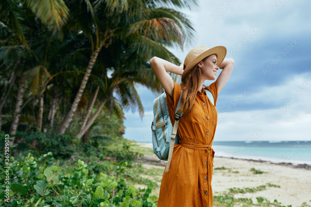 Tourist with backpack beautiful woman on the island 