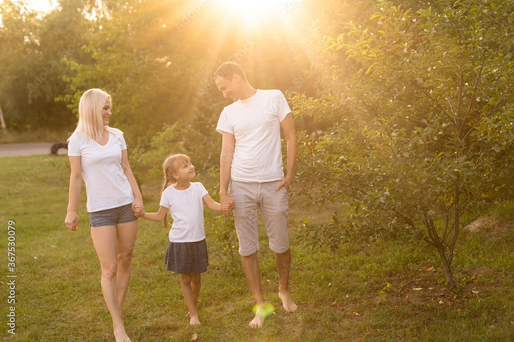 Fototapeta premium happy young family spending time outdoor on a summer day