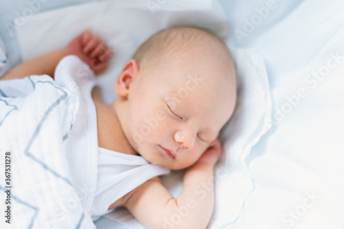 Sleeping newborn in the crib