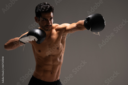 Confident Young Latin Athlete Practicing Boxing