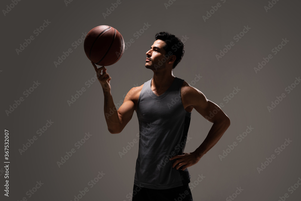 Hispanic Athletic Man With Basketball
