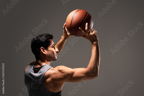 Handsome Male Athlete Playing Basketball